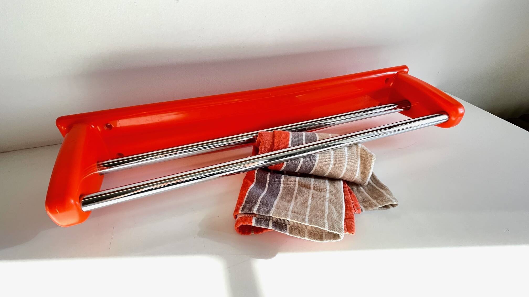 Orange towel rack by Syla from the 70s