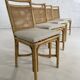 Suite de 4 chaises en rotin cannage et laiton