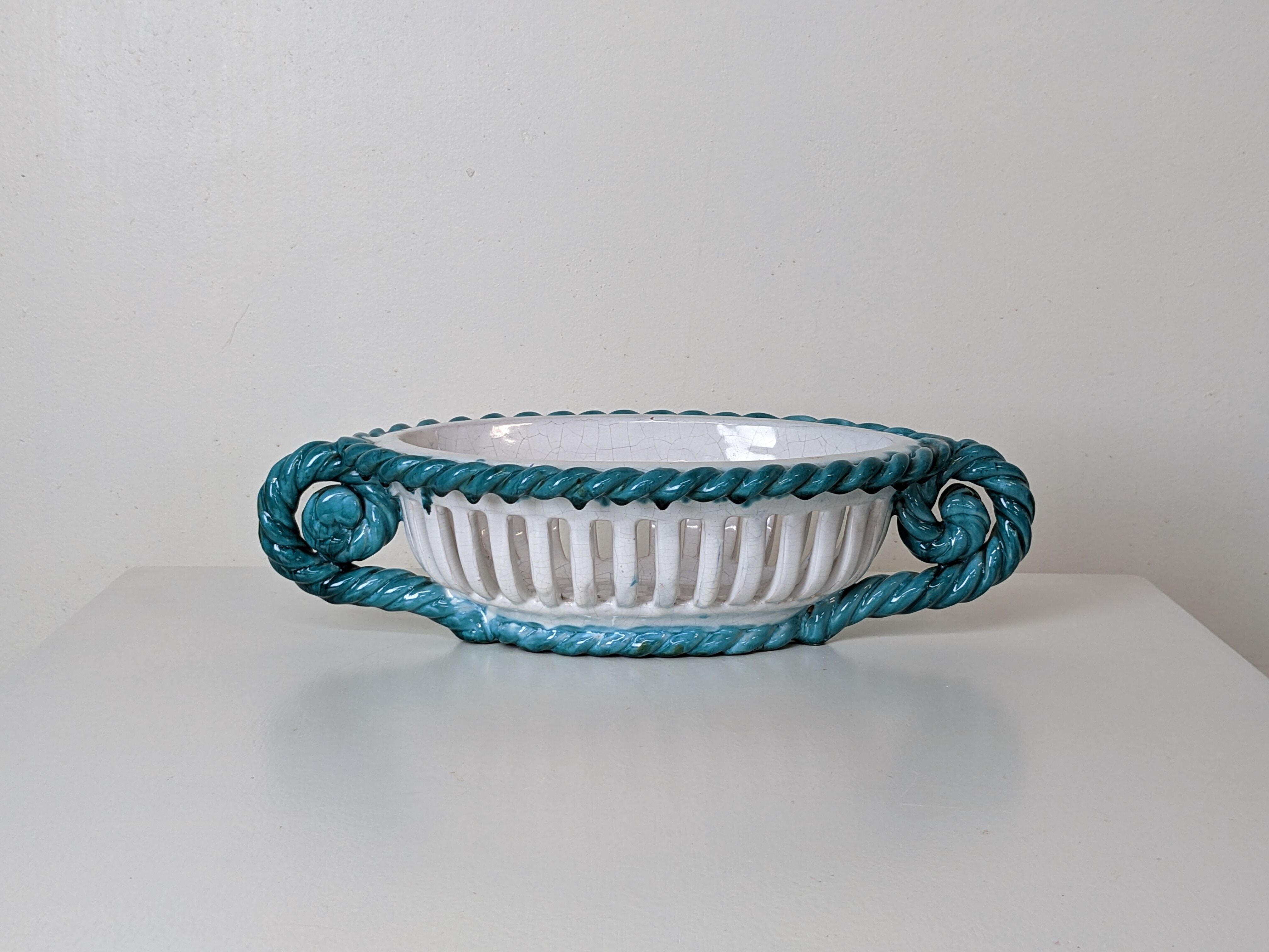 Set of 2 twisted earthenware fruit baskets by Sainte Radegonde, 50s