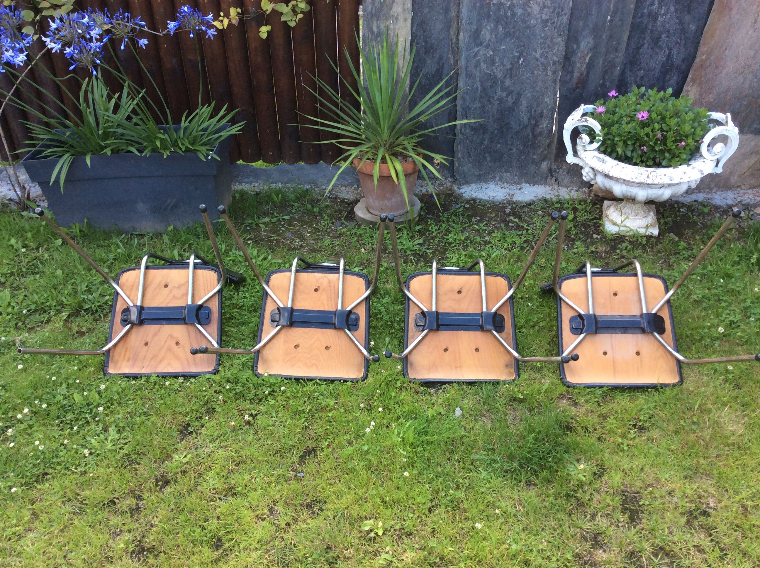 4 Chairs with chrome tubular metal base and black Skaï