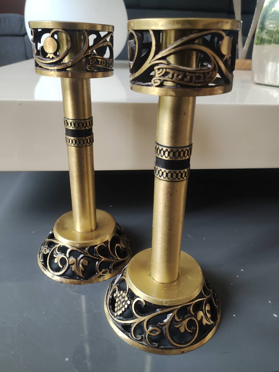 Pair of Hebrew Candlesticks. In antique gold-plated brass. Signed FFS Israel