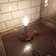Small hand-held candle holder lamp in vintage gold metal