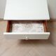 Vintage bedside table with tapered legs