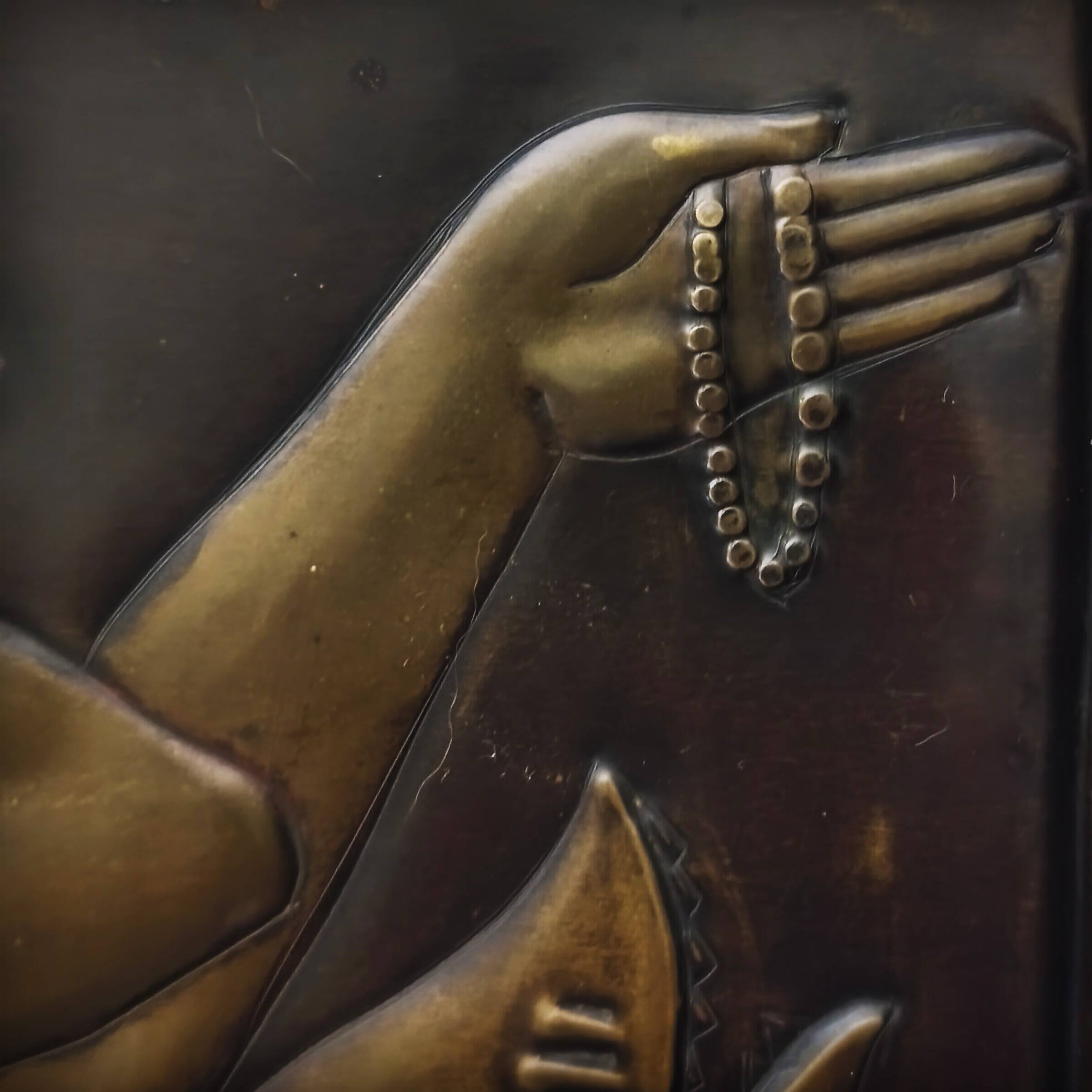 Brass table featuring a woman and a dolphin, France, 1960s.