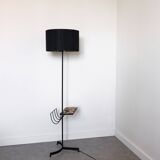 Black metal magazine rack floor lamp with ceramic shelf
