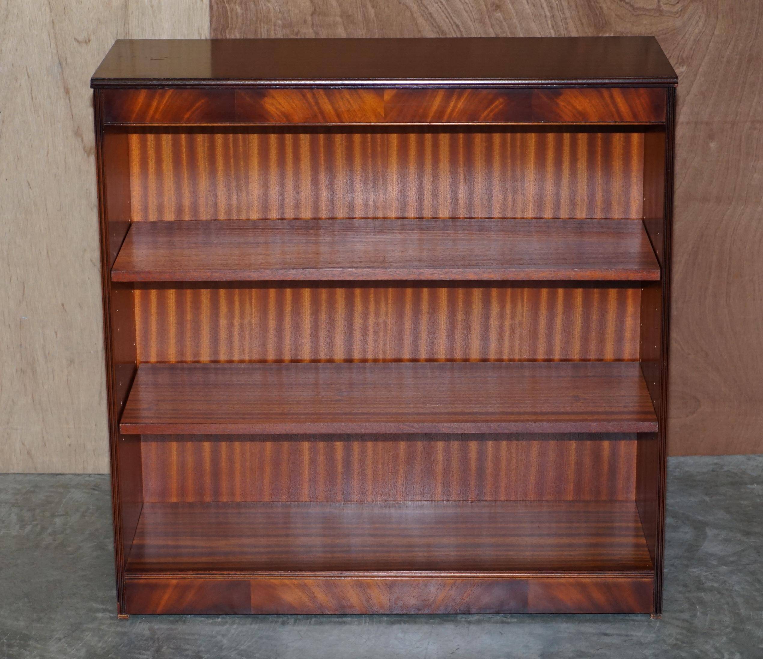 Pair of open low bookshelves Shaws of London in hardwood.