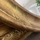 Miroir en bois doré patiné 58cm