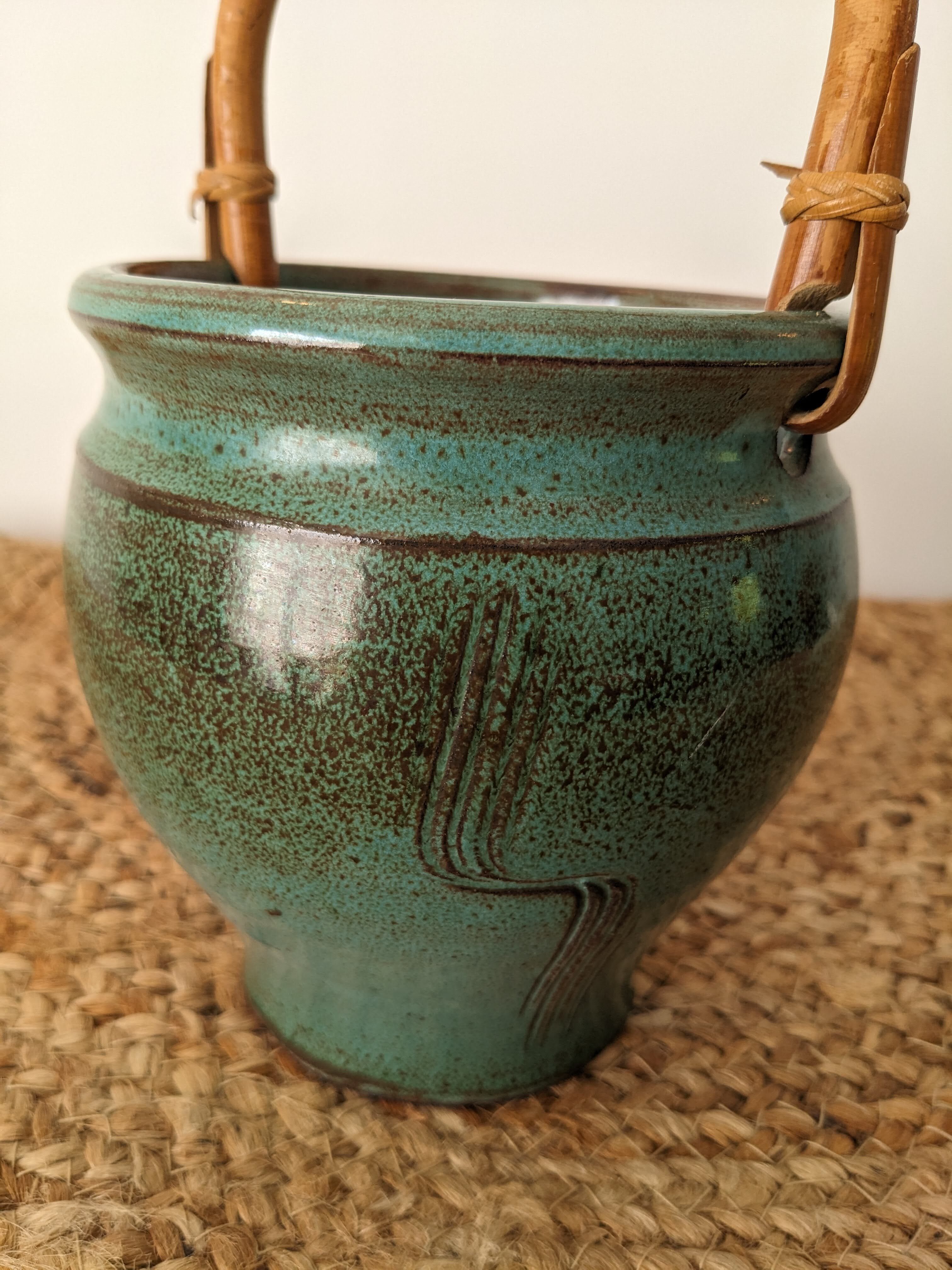 Ceramic pot with rattan handle