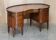 Regency style hardwood and leather kidney desk with gallery.