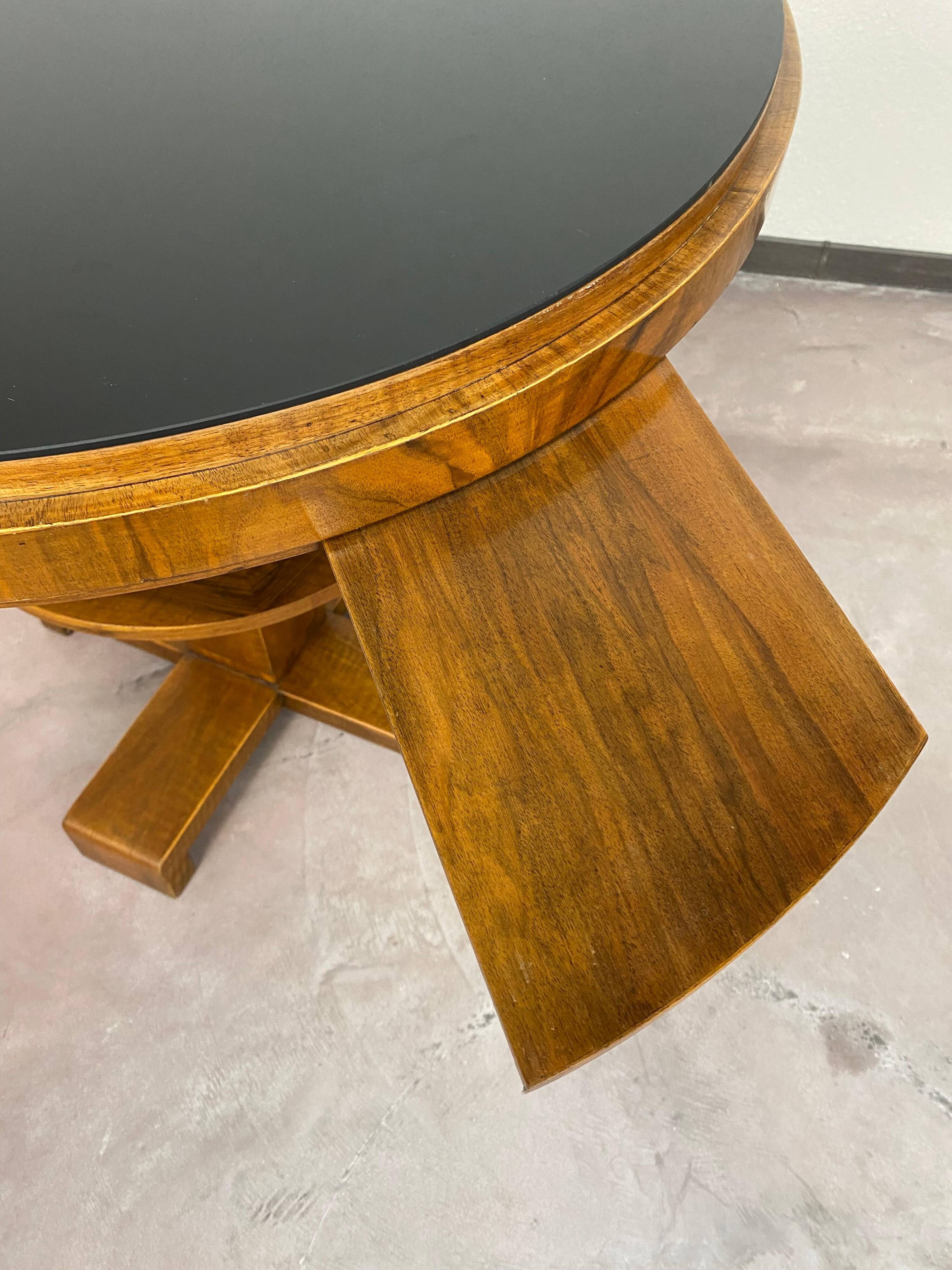 Art Deco game table with a black glass top.