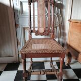 Chair with a decoration of foliage and bunches of grapes