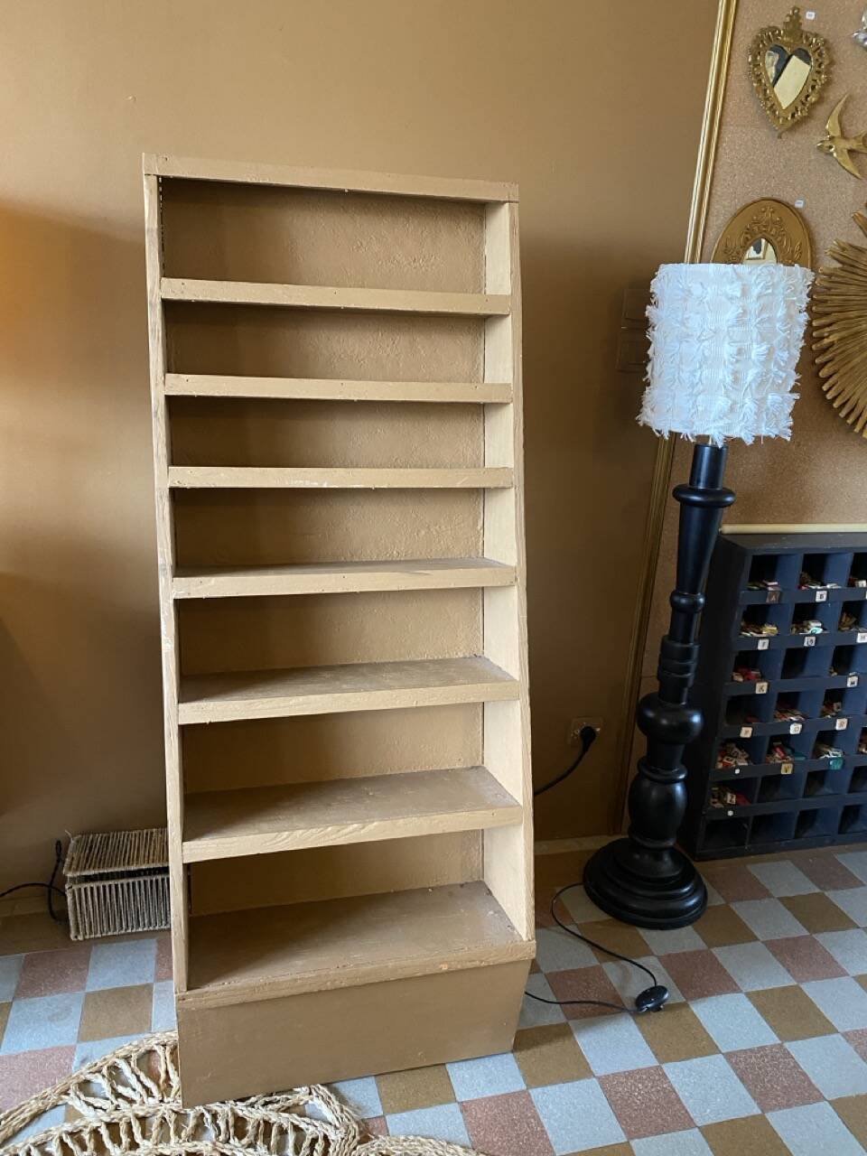 Painted wooden display shelf with an incline