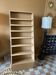 Painted wooden display shelf with an incline