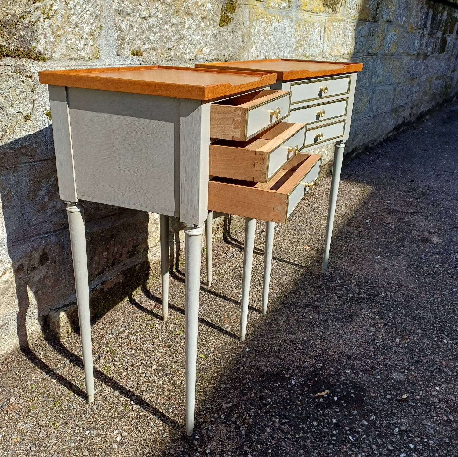 Pair of patinated bedside tables in Louis XVI style