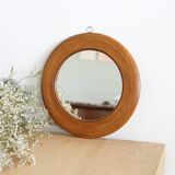 Antique round mirror with turned wooden frame