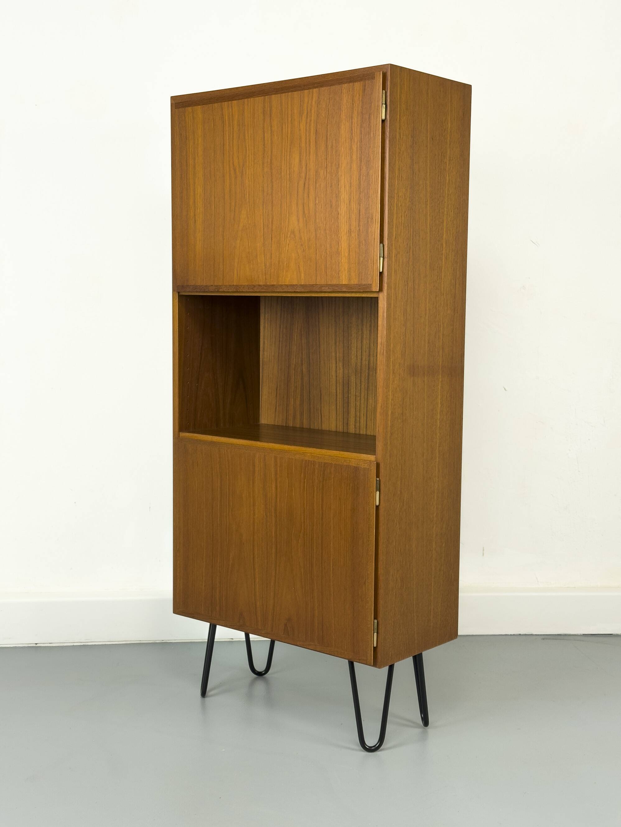 Narrow teak bookcase with two doors by Omann Jun, 1970s