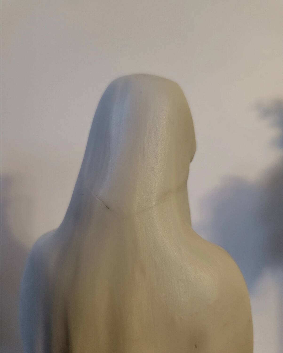 Religious statuette of the Virgin Mary in bisque porcelain