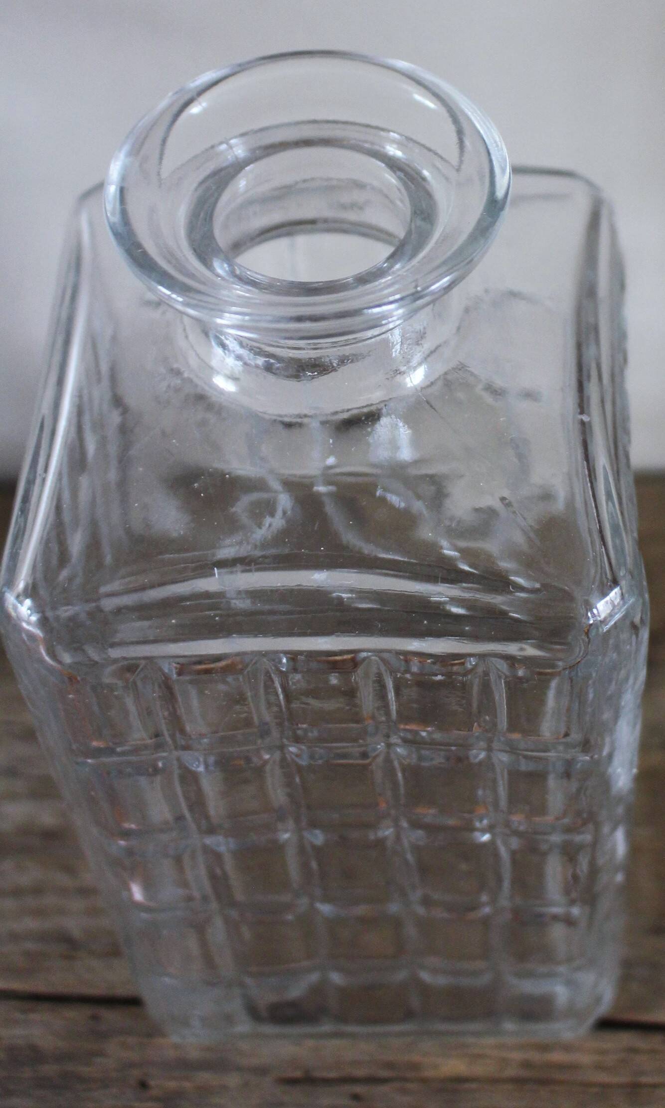 Vintage glass water carafe with rectangular vase.