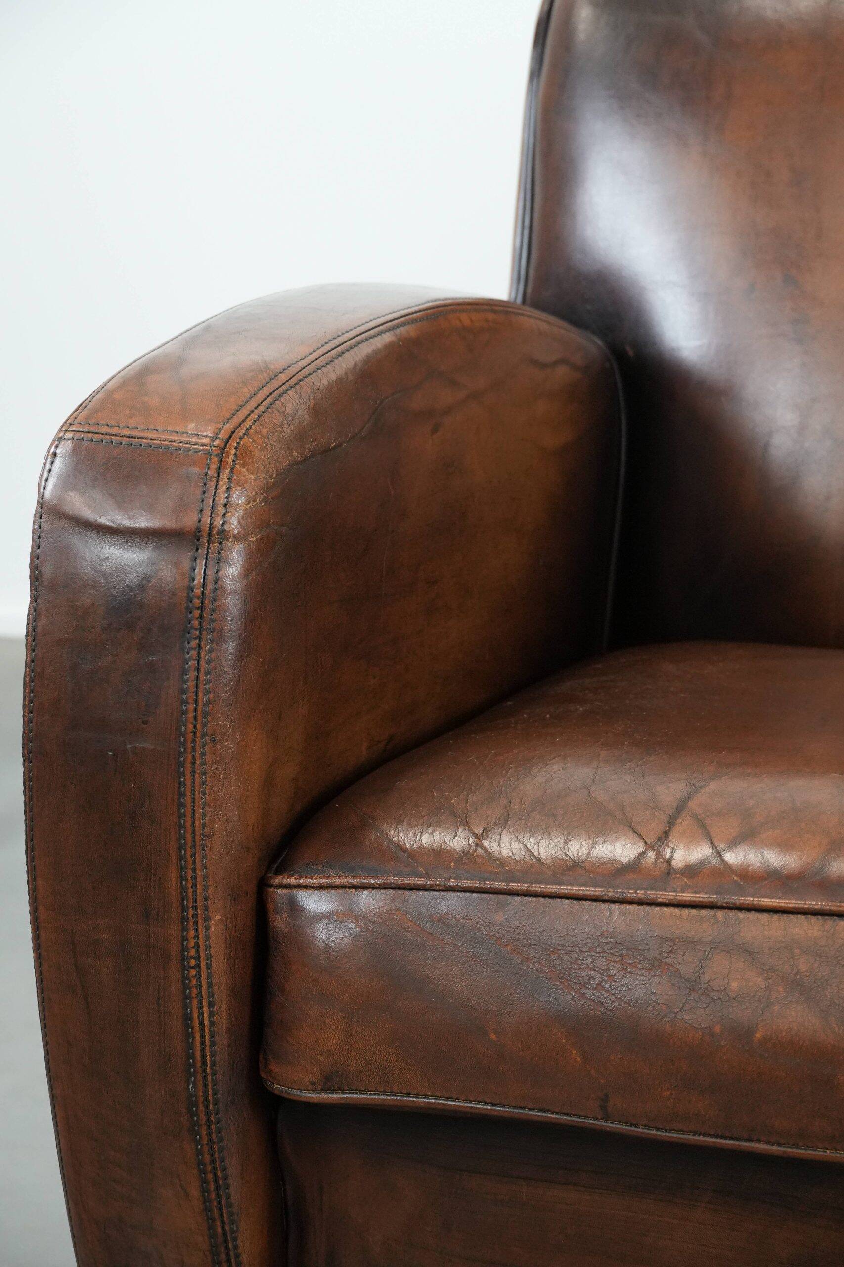 Beautifully shaped vintage sheepskin armchair with character