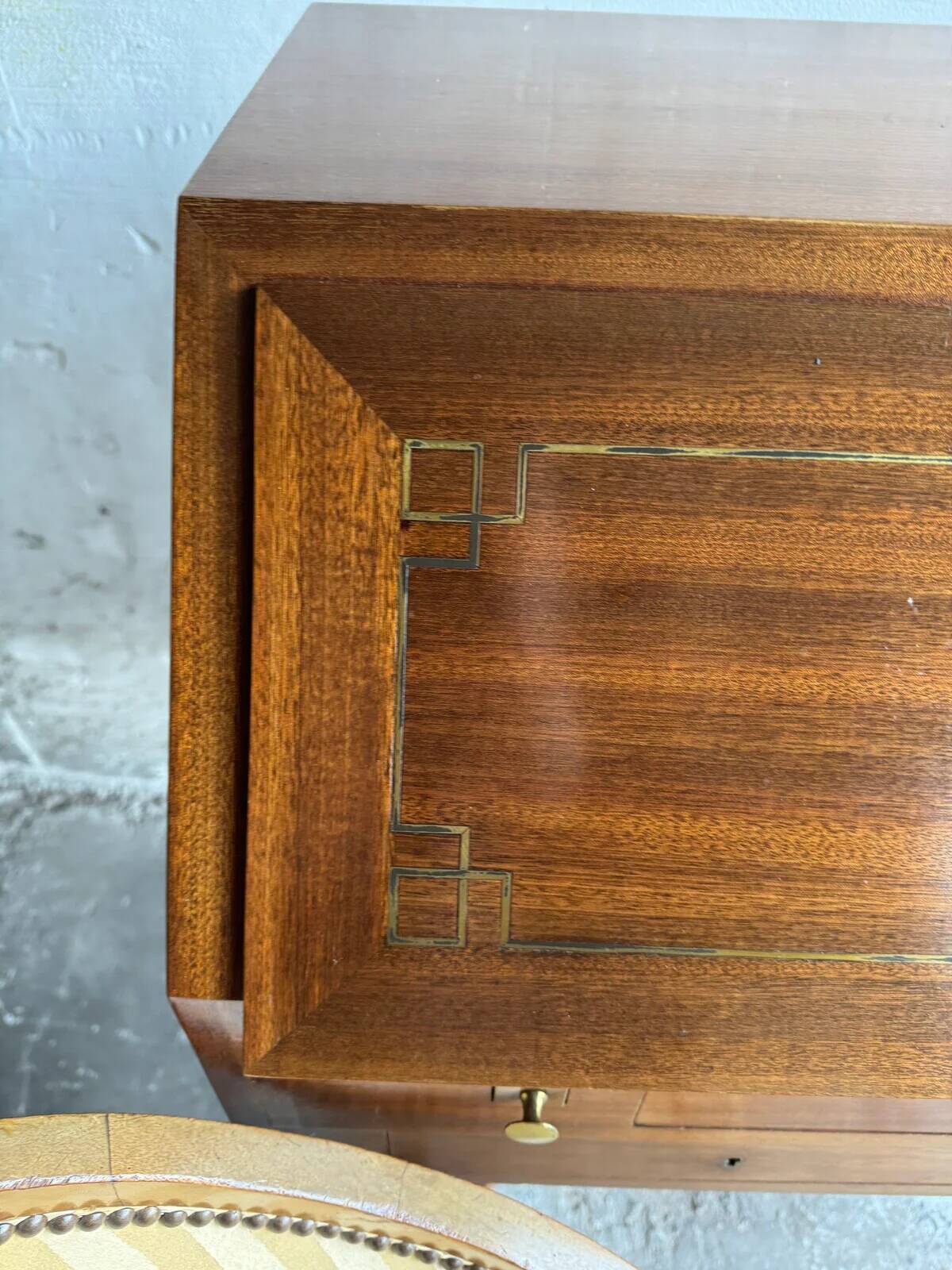 DeCoene antique wood writing desk with beige striped upholstered chair, brass-accented classic set