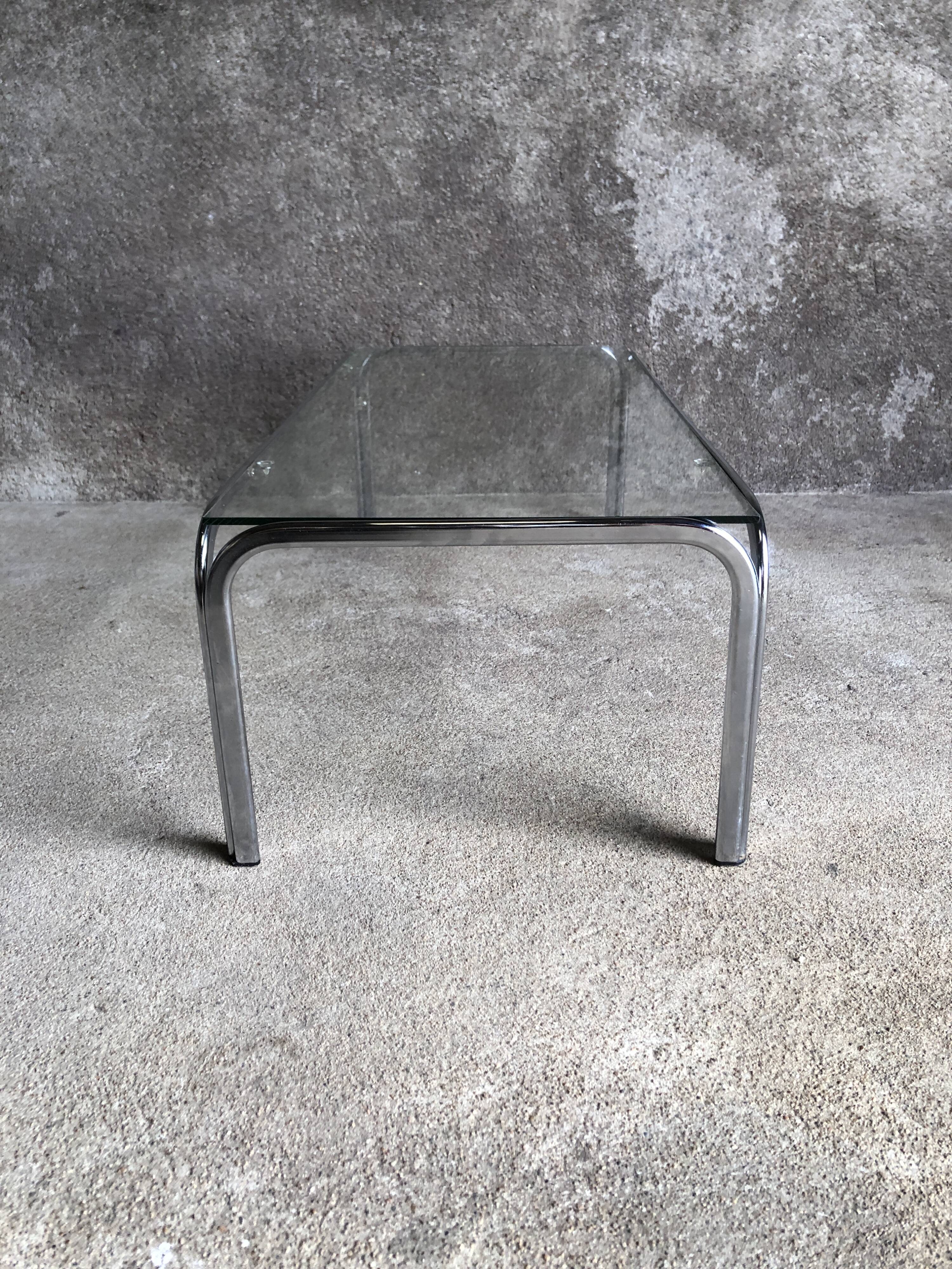 Coffee table with chrome legs and glass top, 1970