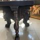 Octagonal oak table, 19th century, with griffins.