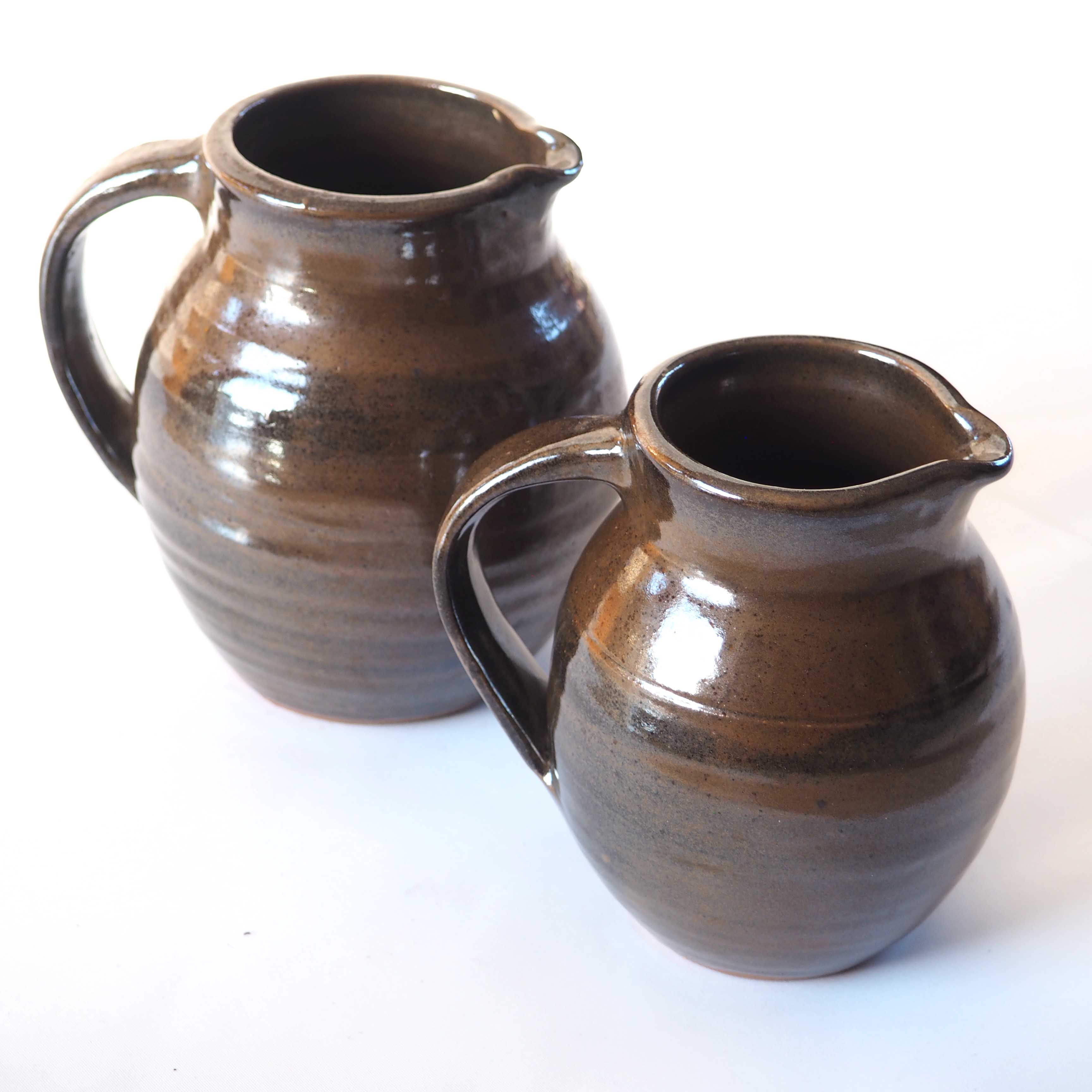 Duo of sandstone pitchers