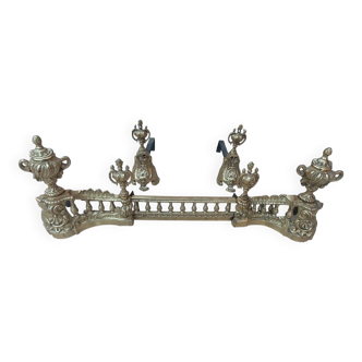 4 andirons and a fireplace bar in gilded bronze in the Louis XVI style.