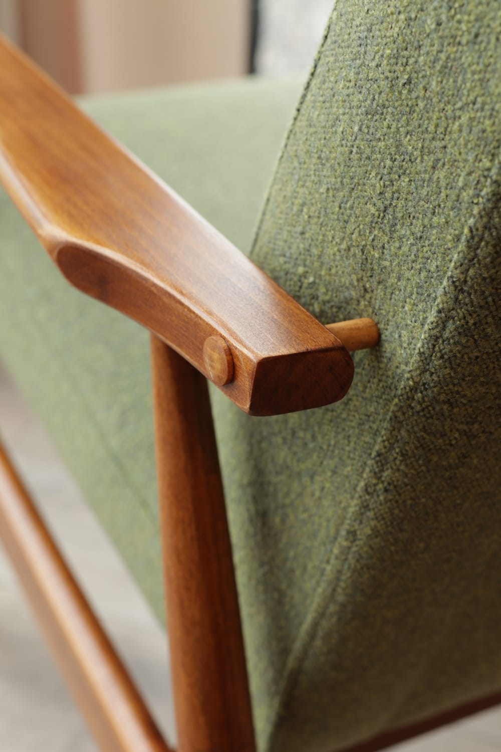 Vintage armchair in swamp green bouclé design by H. Lis.