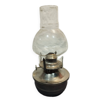 Old metal oil lamp with its wick and glass