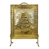 Fireplace screen in repoussé brass with a sailing boat. 1960s.
