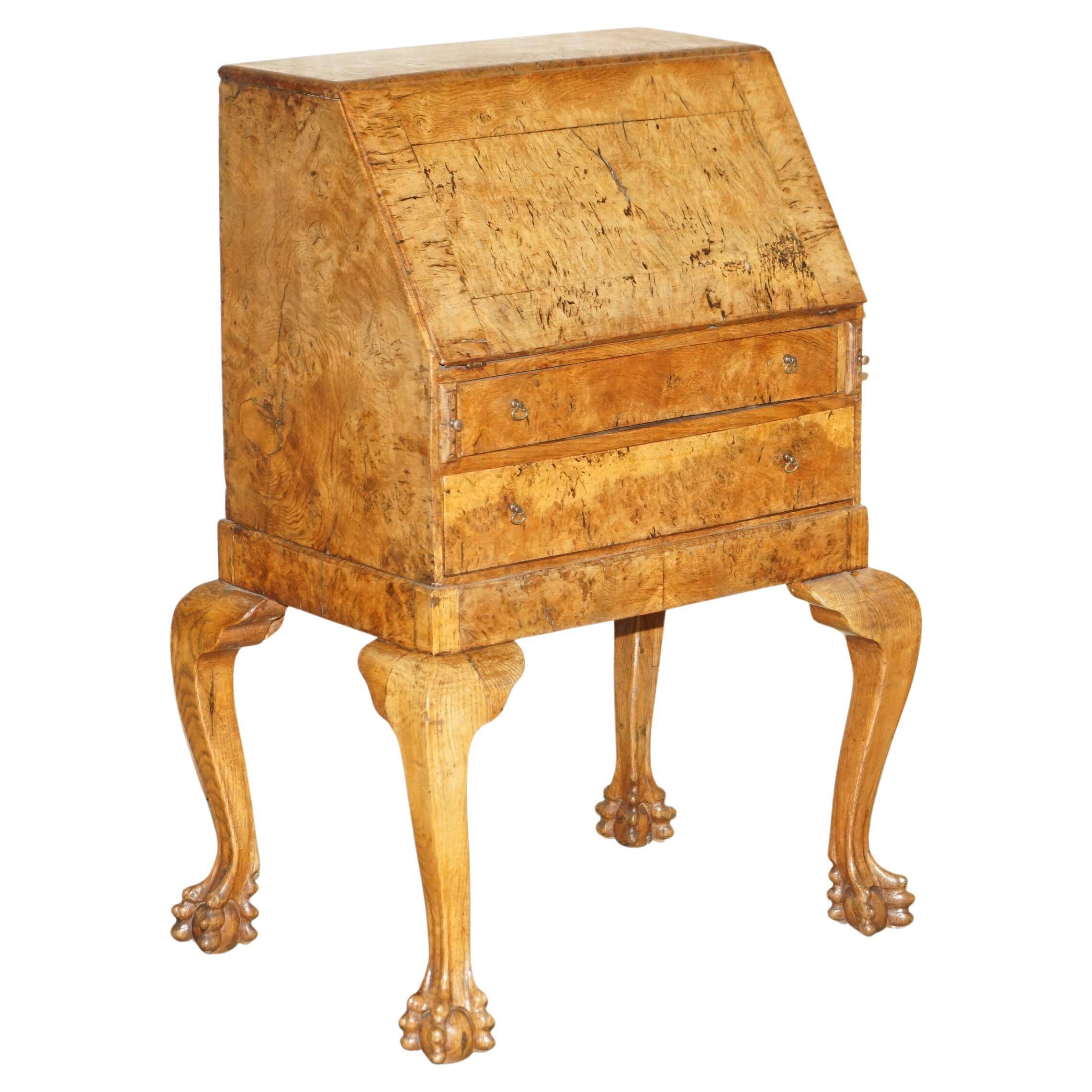 Writing desk in pollard oak from around 1800 with claw and ball carved legs.