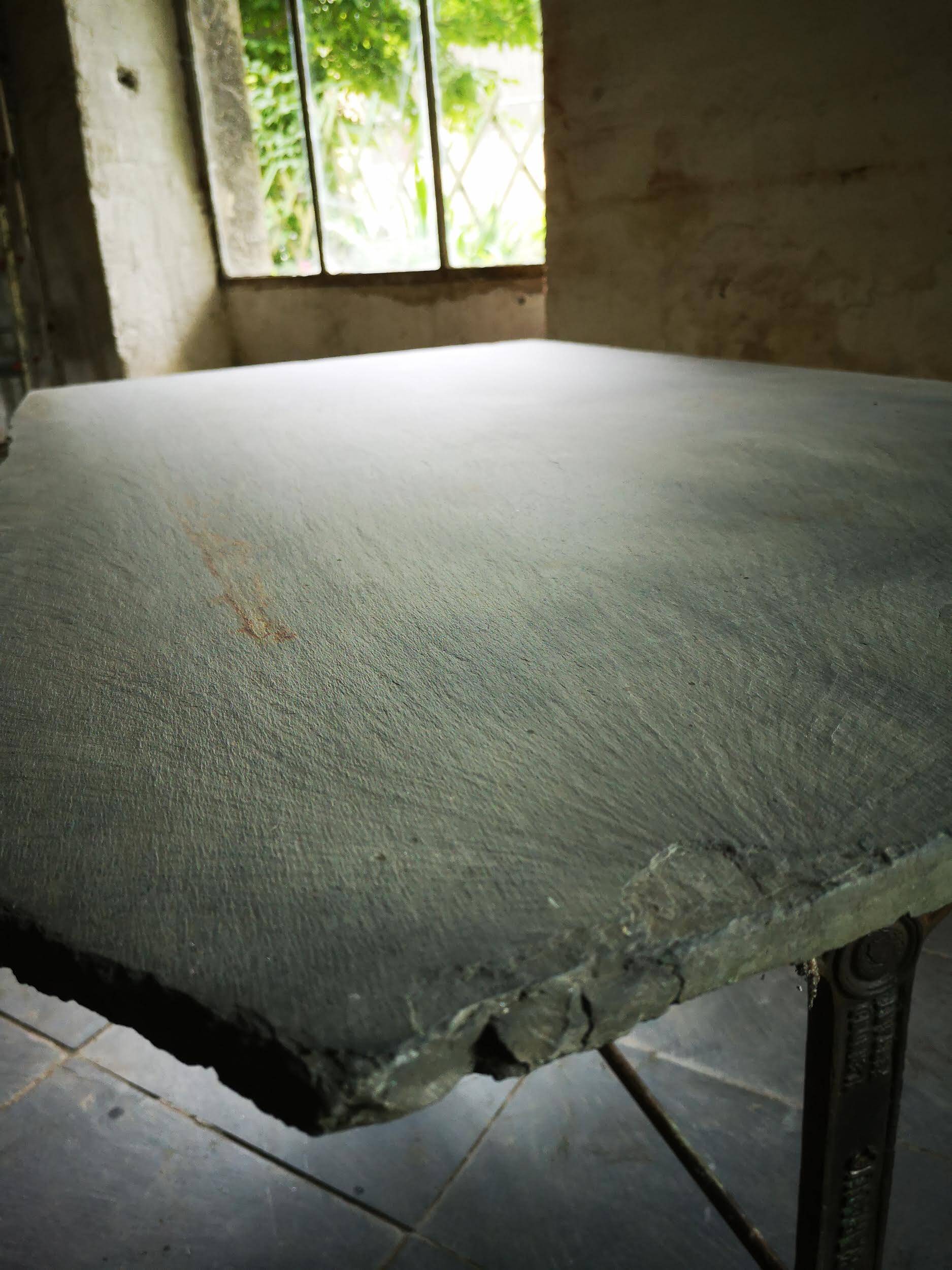 Old bistro table – cast iron legs and natural slate top