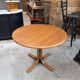 Modular round teak table with central base by Osvaldo Borsani.