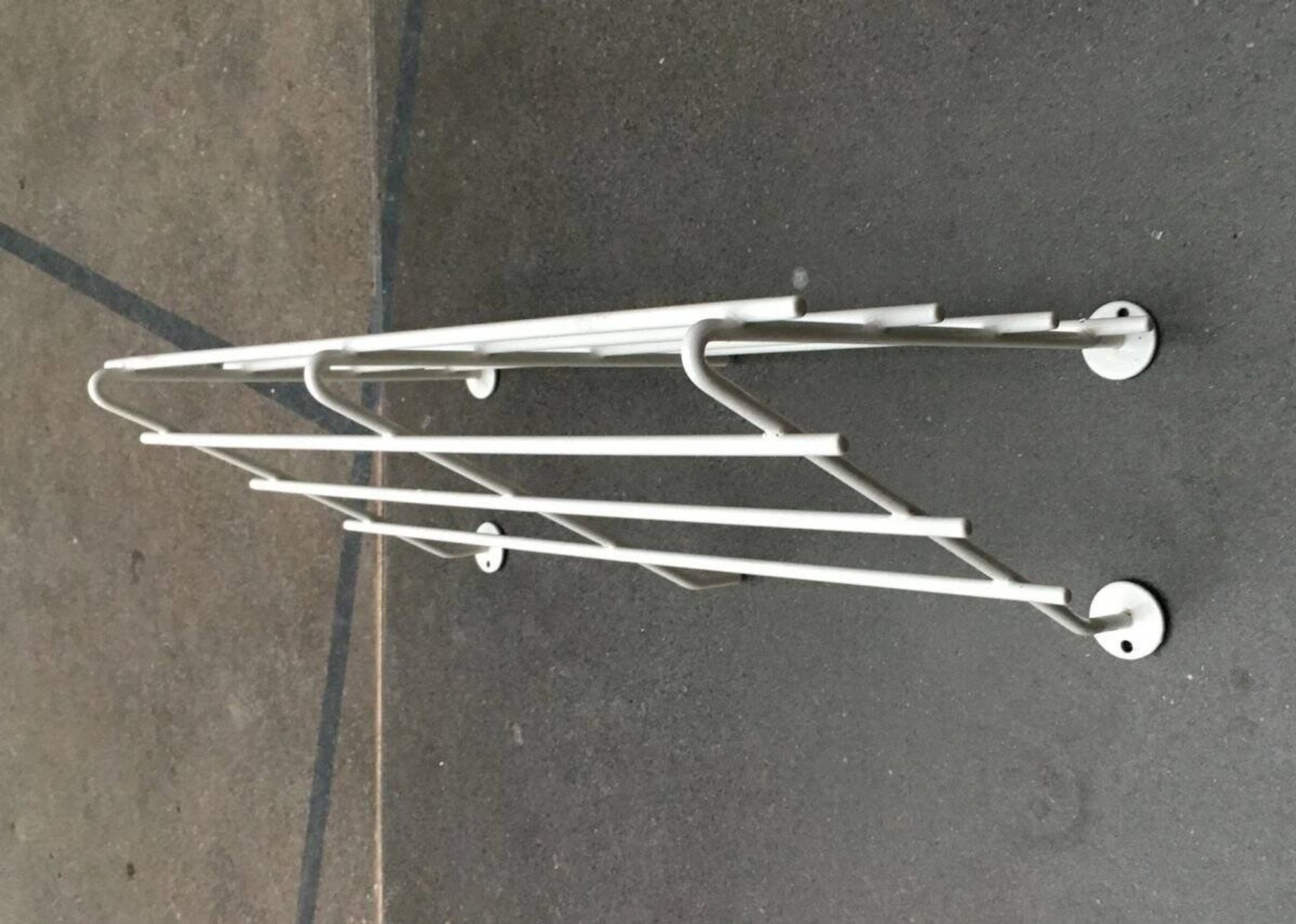 Mid-century modern minimalist metal coat rack from the 1960s.