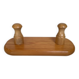 Small wooden coat rack with two hooks