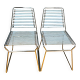 2 metal chairs with bungee cords