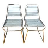 2 metal chairs with bungee cords