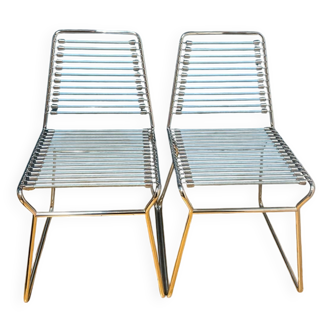 2 metal chairs with bungee cords