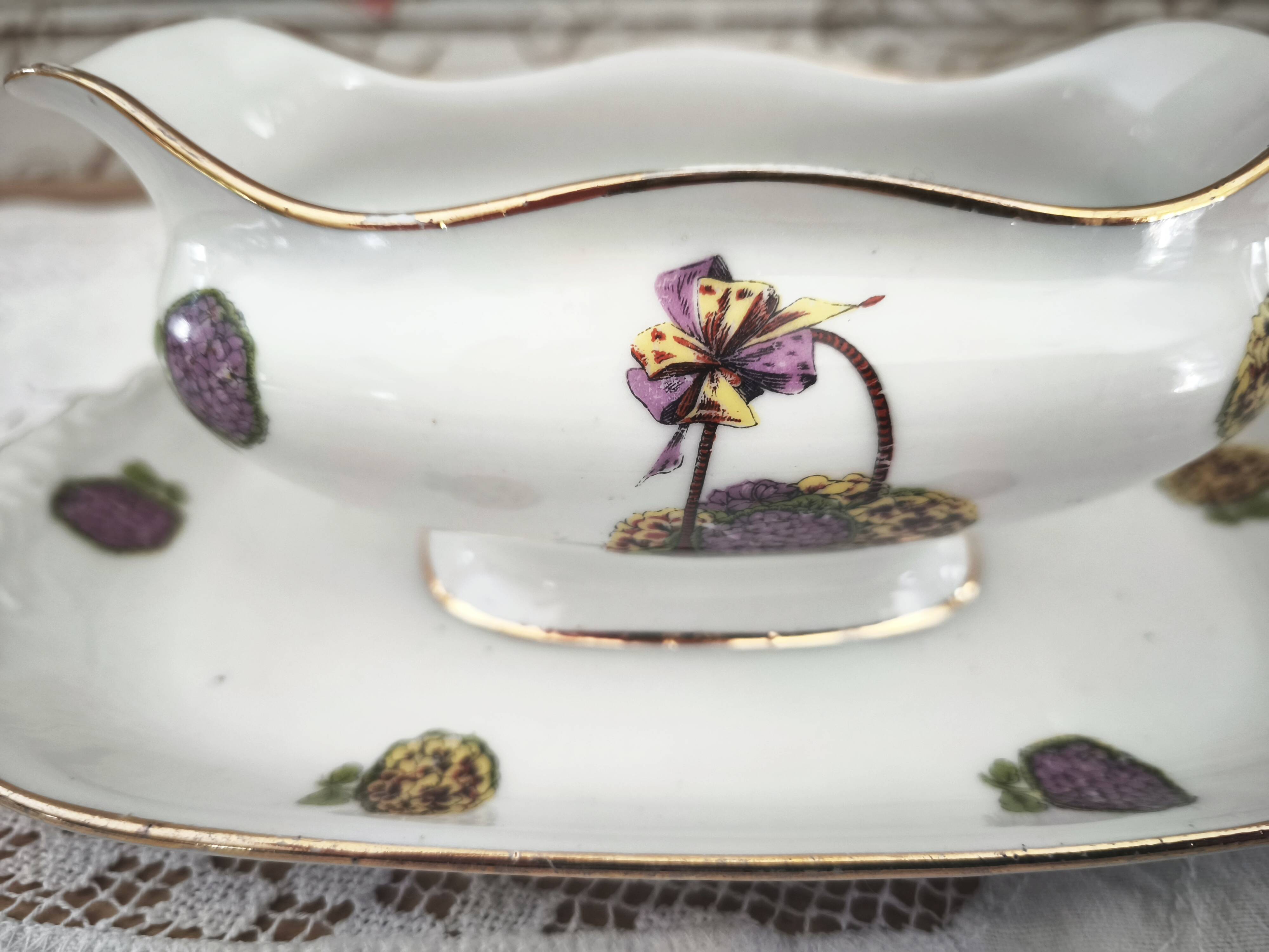 Sauce boat on a Limoges porcelain base with a hydrangea basket design.