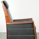 Electrically adjustable Art Deco design recliner with black cowhide leather