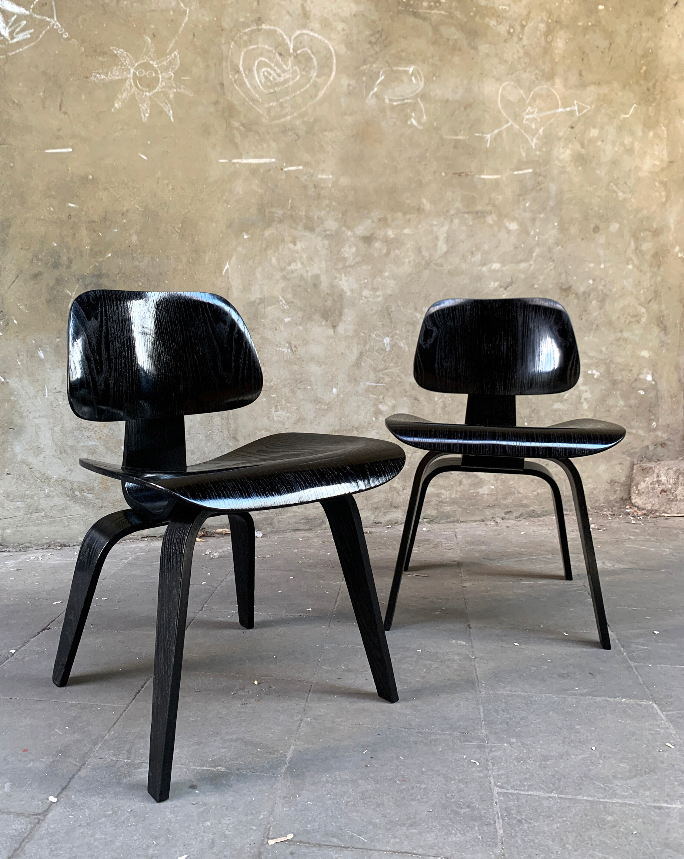 Pair of DCW chairs by Charles & Ray Eames in Black for Herman Miller 1950