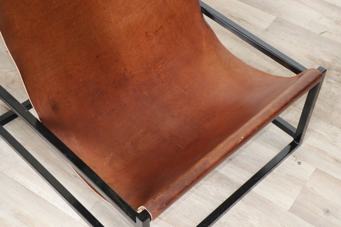 Pair of vintage armchairs in stretched leather and metal structure
