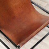 Pair of vintage armchairs in stretched leather and metal structure