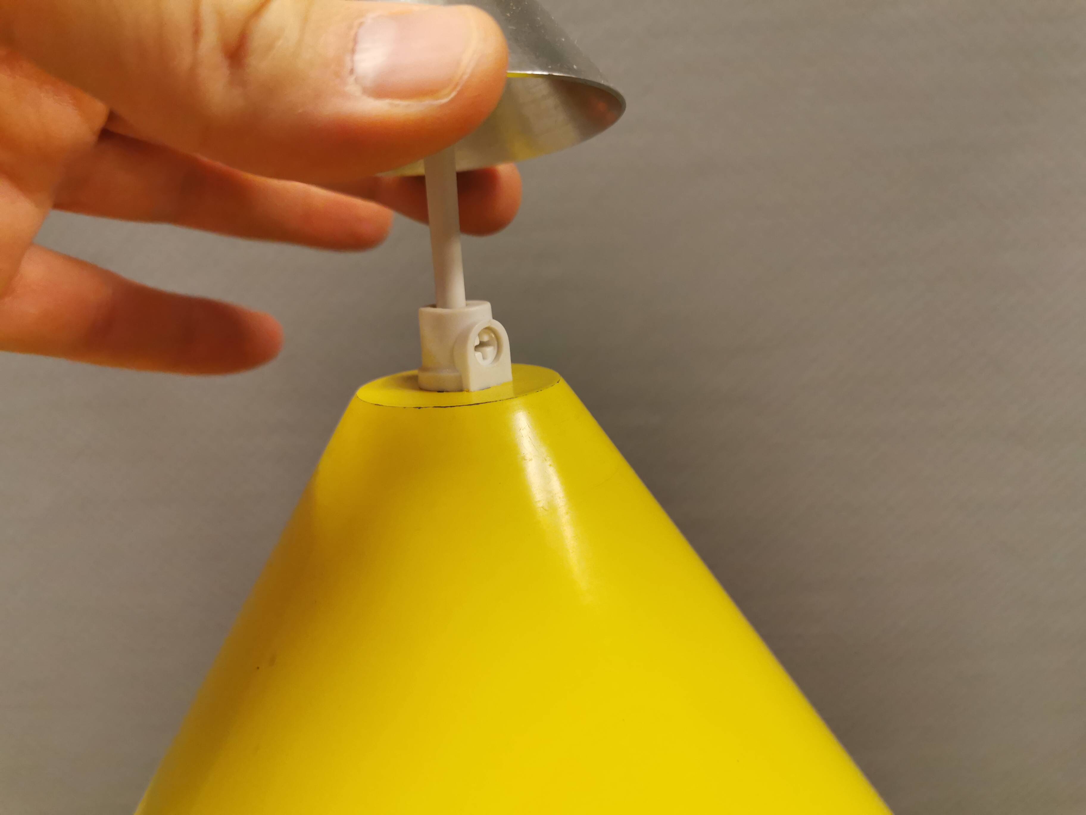 Small cone-shaped lamp in beautiful yellow lacquer finish.