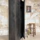 Industrial locker room in raw metal, circa 1930.