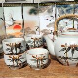 Asian set of a teapot and its cups