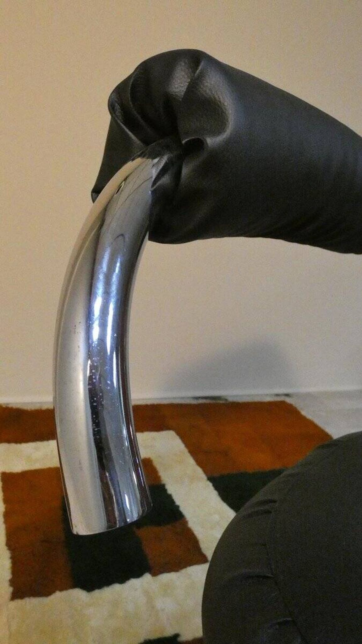 Cobra chairs in steel and black leather by Giotto Stoppino, 1970s, set of 5.
