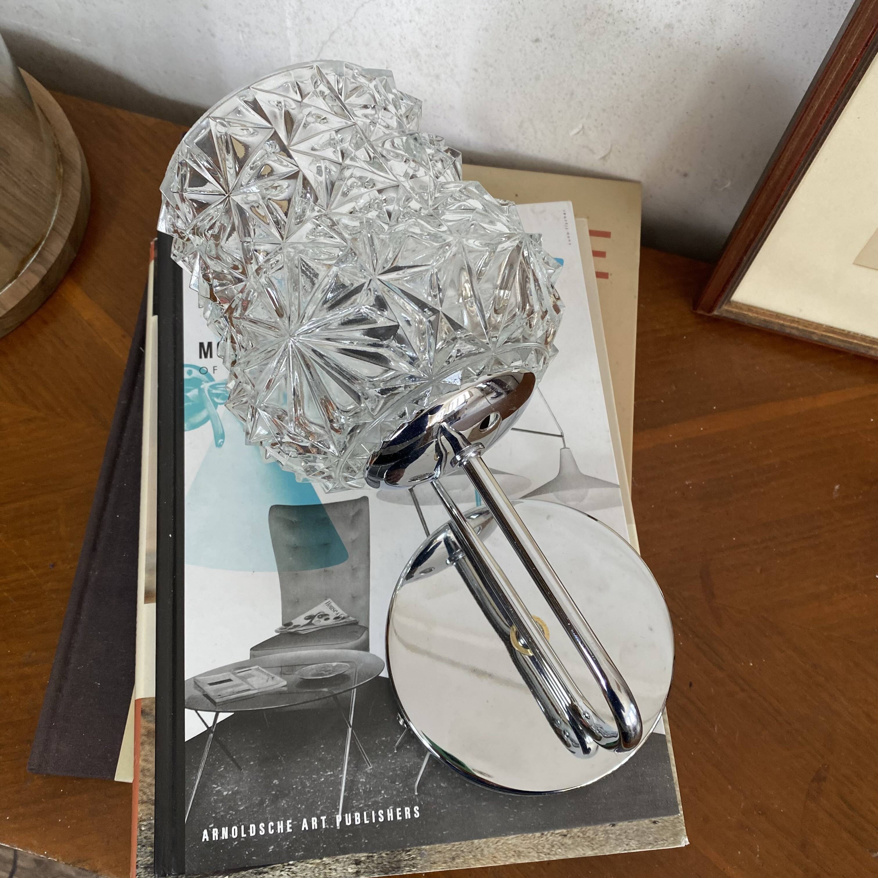 Swan neck wall light in stainless steel, thick glass shade, stainless steel rose.