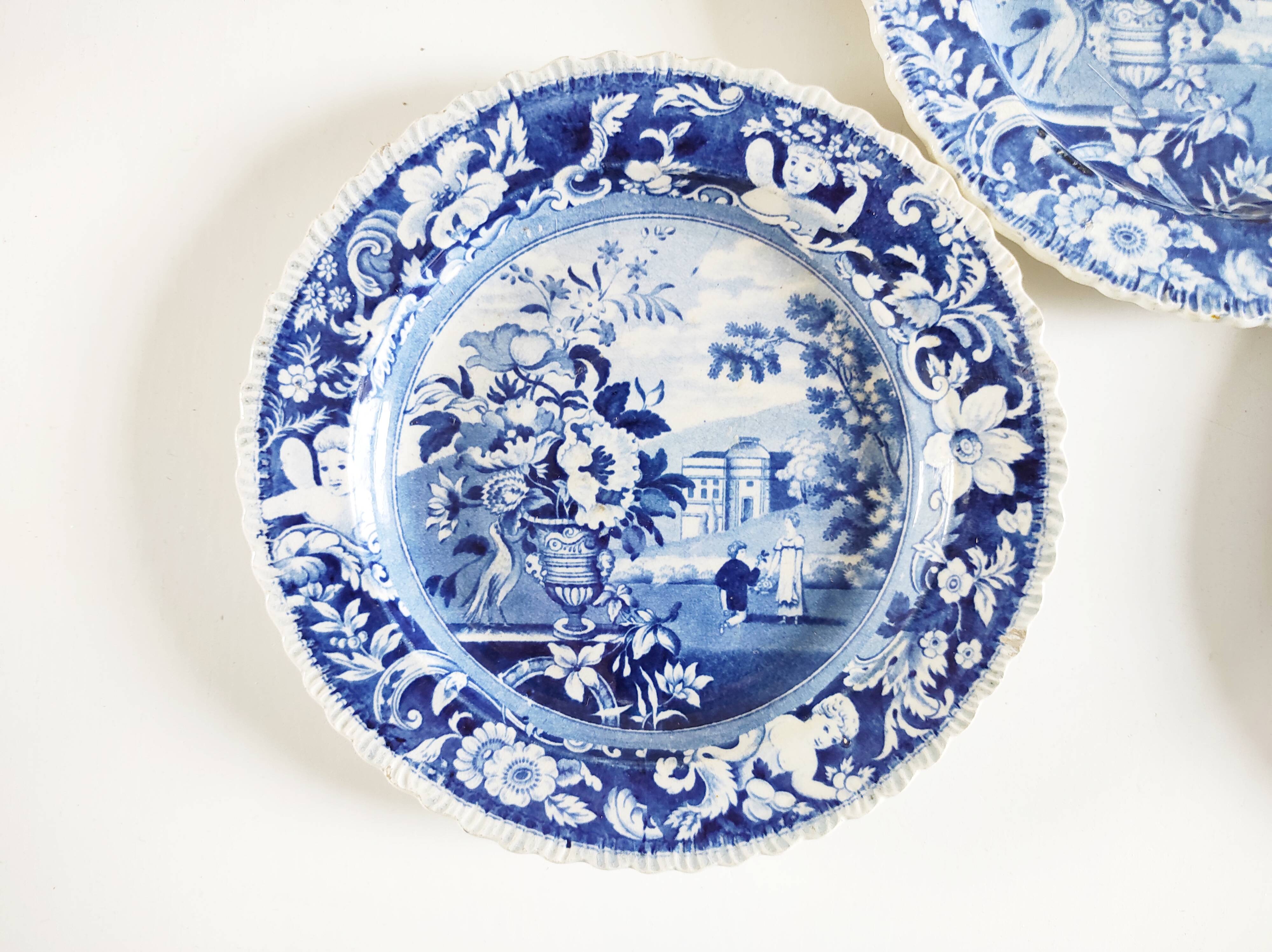 Five 19th century Calais earthenware plates with a romantic gallant couple decor